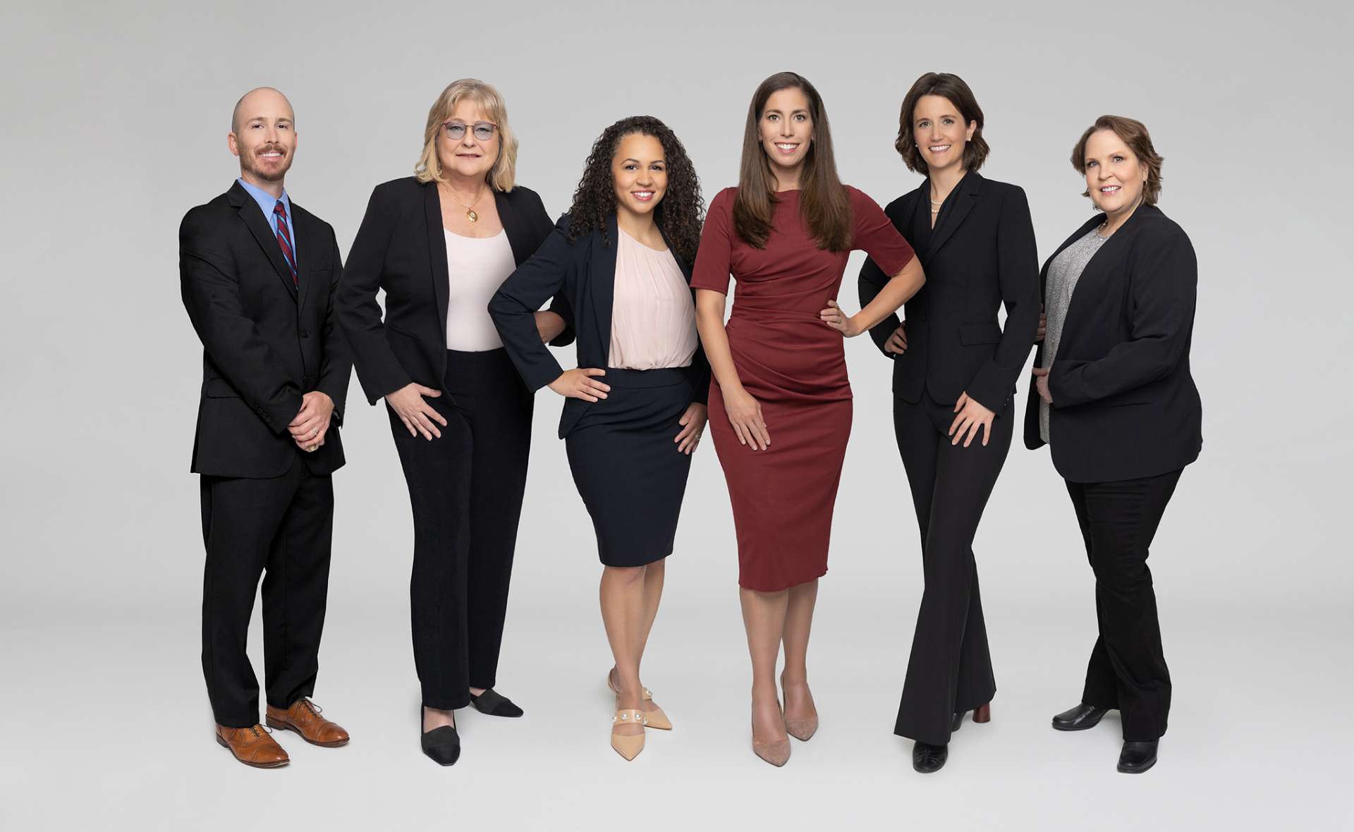 a group of people posing for a staff photo